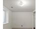 Bright room featuring a large window letting in natural light, with neutral walls and carpet at 4627 S Norfolk Way, Aurora, CO 80015