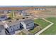 Aerial view showcasing a home, neighborhood, and the surrounding landscape at 5805 Red Barn Ave, Longmont, CO 80504