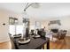 Formal dining room with dark wood table and seating for four at 670 S Oswego St, Aurora, CO 80012