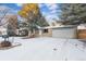 Updated ranch home with a gray garage door and landscaping at 670 S Oswego St, Aurora, CO 80012