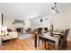 Bright living room with hardwood floors, fireplace, and dining area at 670 S Oswego St, Aurora, CO 80012