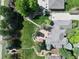 Aerial view of the property, showing its layout, landscaping, patio, and surrounding neighborhood at 6940 Saddleback Ave, Firestone, CO 80504