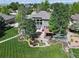 Stunning aerial view of the home showcasing the expansive backyard, lush landscaping, and outdoor living spaces at 6940 Saddleback Ave, Firestone, CO 80504