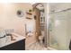 Bathroom featuring a shower, vanity, and unique tile accents at 6940 Saddleback Ave, Firestone, CO 80504