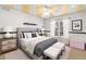 Bedroom featuring a ceiling fan, plush carpeting, and modern furnishings at 6940 Saddleback Ave, Firestone, CO 80504
