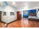 Modern bedroom with a tufted headboard bed and a large closet at 6940 Saddleback Ave, Firestone, CO 80504