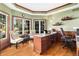 Charming office space with wood trim, natural light, and hardwood floors at 6940 Saddleback Ave, Firestone, CO 80504