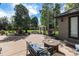 Inviting outdoor patio with a fire pit and comfortable seating, perfect for relaxing evenings at 6940 Saddleback Ave, Firestone, CO 80504