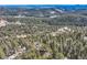 Breathtaking aerial view capturing expansive mountains and dense forest, conveying a sense of natural beauty at 21437 Alta Dr, Morrison, CO 80465
