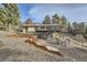 Spacious backyard featuring a deck, staircase, and outdoor seating area at 21437 Alta Dr, Morrison, CO 80465