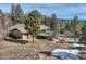 Beautiful mountain home with a deck and outdoor seating area for entertaining at 21437 Alta Dr, Morrison, CO 80465