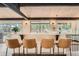 Home bar with seating overlooking views of the forest at 21437 Alta Dr, Morrison, CO 80465