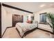 Charming bedroom featuring wooden closet doors and a comfortable bed at 21437 Alta Dr, Morrison, CO 80465