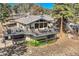 Stunning home featuring an expansive deck with outdoor seating at 21437 Alta Dr, Morrison, CO 80465