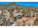 Beautiful view of the house nestled in the forest with decks and ample privacy at 21437 Alta Dr, Morrison, CO 80465