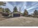 Detached two-car garage with a stone and wood exterior at 21437 Alta Dr, Morrison, CO 80465