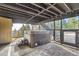 Features an outdoor hot tub area with exposed beams, stairs, and access to a patio with a view at 21437 Alta Dr, Morrison, CO 80465