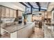 Gourmet kitchen featuring custom cabinets, granite countertops, and stainless steel appliances at 21437 Alta Dr, Morrison, CO 80465