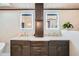 Double vanity in primary bathroom with large mirrors and lighting at 21437 Alta Dr, Morrison, CO 80465