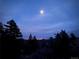 Scenic night view from the property with city lights in the distance at 21437 Alta Dr, Morrison, CO 80465