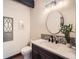 Charming powder room with decorative tiles and an artistic mirror at 21437 Alta Dr, Morrison, CO 80465