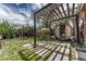 Landscaped backyard features a barrel sauna, and pergola-covered patio area at 1334 Xavier St, Denver, CO 80204