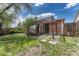 This landscaped backyard features a barrel sauna and covered patio area at 1334 Xavier St, Denver, CO 80204