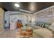 Stylish basement living room with a sectional sofa, coffee table, and vintage-inspired decor at 1334 Xavier St, Denver, CO 80204