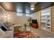 Cozy basement living room featuring a sectional sofa, coffee table, and stylish decor at 1334 Xavier St, Denver, CO 80204