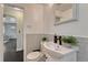 Clean bathroom featuring vanity and tiled wall at 1334 Xavier St, Denver, CO 80204