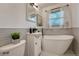 Modern bathroom featuring a soaking tub, vanity and tiled walls at 1334 Xavier St, Denver, CO 80204
