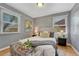 Charming bedroom with large windows providing natural light and hardwood floors at 1334 Xavier St, Denver, CO 80204