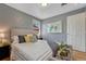 Comfortable bedroom featuring hardwood floors, large window and overhead lighting at 1334 Xavier St, Denver, CO 80204