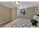 A cozy bedroom featuring carpet, a bed, and a wooden closet door at 1334 Xavier St, Denver, CO 80204
