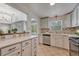 Open concept kitchen features white countertops and stainless steel dishwasher at 1334 Xavier St, Denver, CO 80204