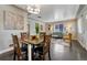 Cozy living room and dining area featuring hardwood floors and abundant natural light at 1334 Xavier St, Denver, CO 80204