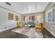 Bright living room featuring hardwood floors, area rug, contemporary furniture, and natural light at 1334 Xavier St, Denver, CO 80204