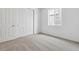 Bright bedroom featuring neutral carpet and a closet at 9673 Ceylon St, Commerce City, CO 80022