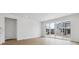 Bright Living room featuring wood floors and a sliding glass door at 9673 Ceylon St, Commerce City, CO 80022