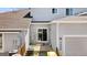 Backyard view showcases gray siding, sliding door access, and partial fencing for added privacy at 3026 S Waco Ct, Aurora, CO 80013