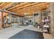 Unfinished basement offers potential with exposed beams, concrete walls, and ample open space at 3026 S Waco Ct, Aurora, CO 80013