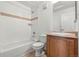 Classic bathroom featuring a tiled shower/tub and a modern vanity with light-colored cabinets at 3026 S Waco Ct, Aurora, CO 80013