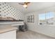Modern bedroom with a bunk bed, star wallpaper, and a bright window offering natural light at 3026 S Waco Ct, Aurora, CO 80013