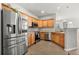 Well-equipped kitchen with stainless steel appliances, wood cabinets and modern countertops at 3026 S Waco Ct, Aurora, CO 80013