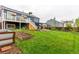 Landscaped backyard with grass, garden beds, and a wooden planter box at 10370 Routt St, Westminster, CO 80021
