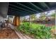 Storage area under deck with garden bed and brick path at 10370 Routt St, Westminster, CO 80021