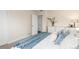 Cozy bedroom features neutral walls, plush carpet, and a large closet at 10370 Routt St, Westminster, CO 80021