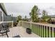 Outdoor deck space featuring white railings and views of the backyard at 10370 Routt St, Westminster, CO 80021