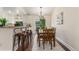 Bright dining room has an elegant light fixture and sliding doors to outdoor deck at 10370 Routt St, Westminster, CO 80021