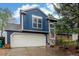 A well-maintained two-story home with a two-car garage, complemented by landscaped surroundings at 10370 Routt St, Westminster, CO 80021